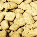 A pile of dry dog food pieces.