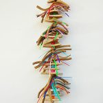 A Rawhide Strips toy hanging on a wall.