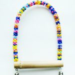 A Small Bead Swing toy with a bell attached to it.